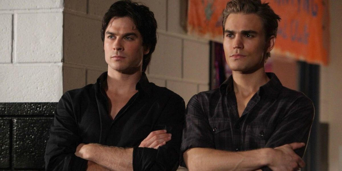 Stefan and Damon with their arms crossed in TVD