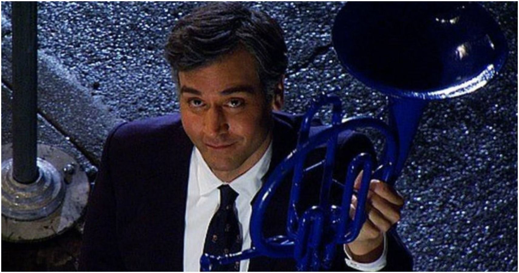 Ted holds the blue French horn to Robin in how i met your mother