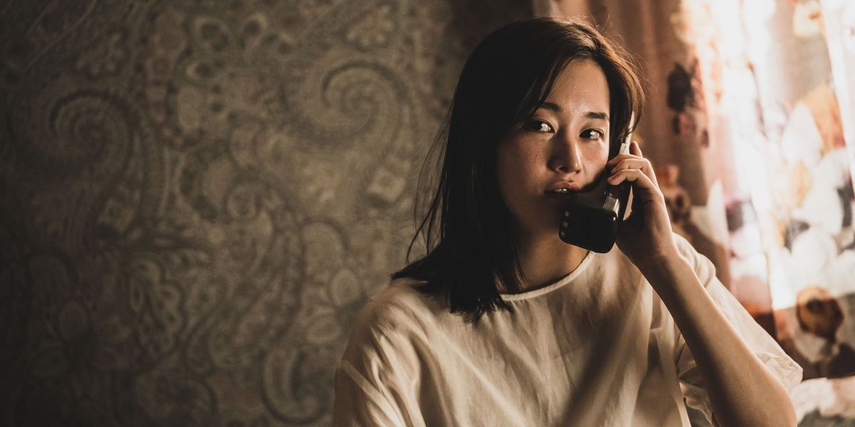 Young-Sook talking on cordless phone in The Call