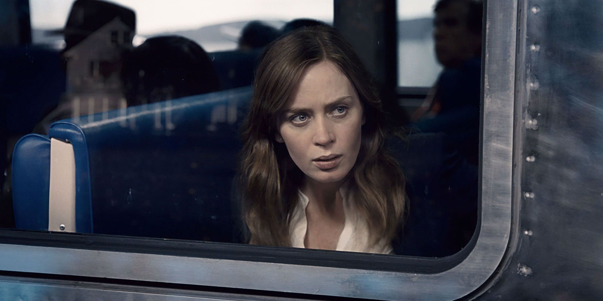 Movie Photo from The Girl On The Train featuring Emily Blunt staring off from the train