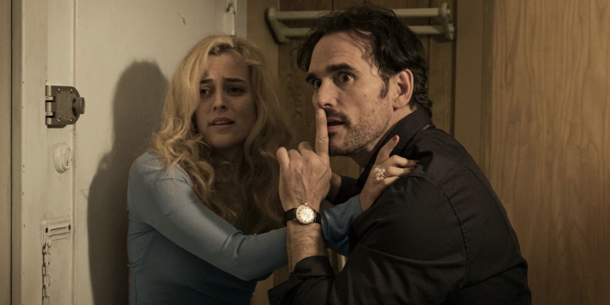 The House That Jack Built: Jack tells the womanto be quiet as they stare at something scary