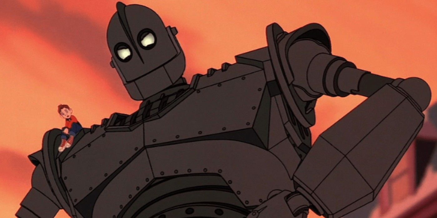 A child sits on a giant robot in The Iron Giant.