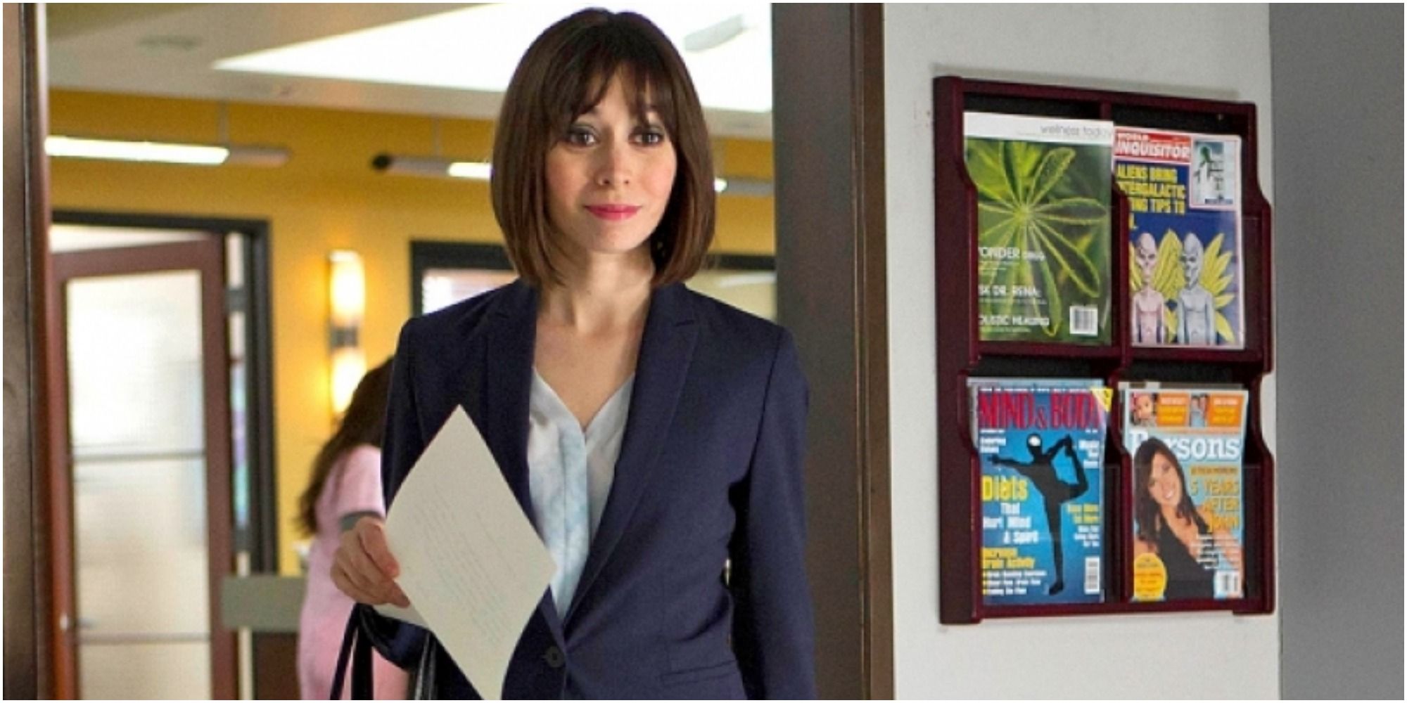 A screenshot of Whitney entering an office in The Mindy Project