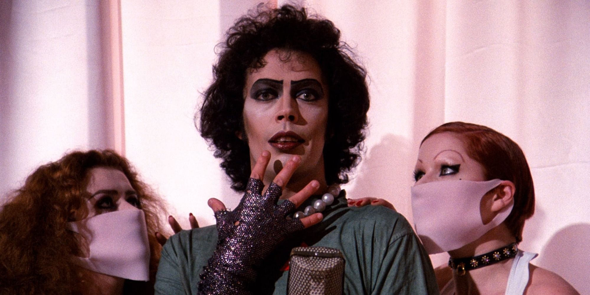 A screenshot of Dr. Frank N. Furter in the middle of a number in The Rocky Horror Picture Show