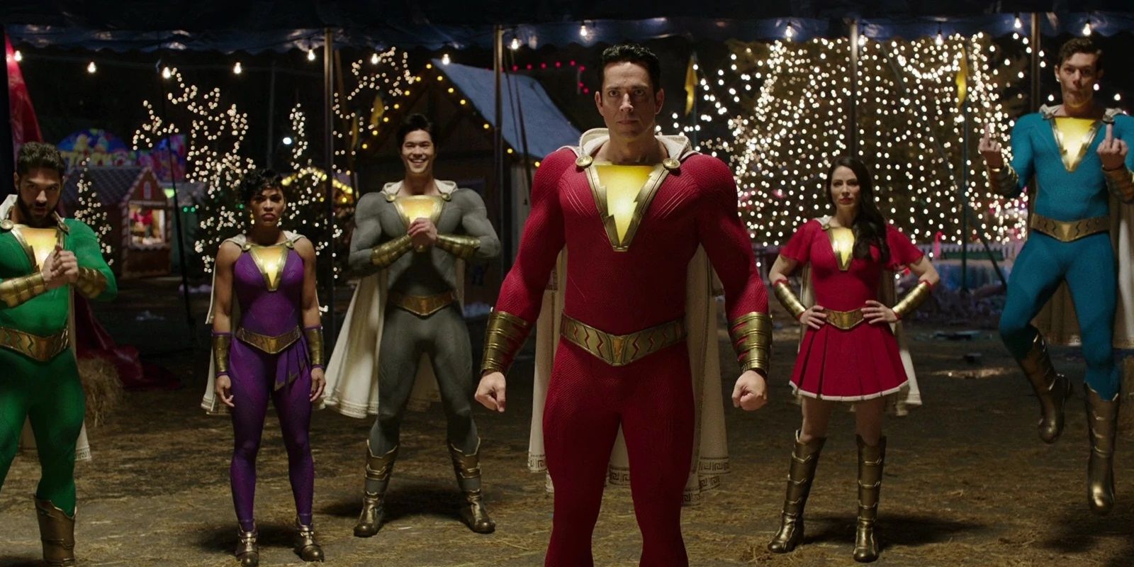 Shazam stands alongside the Marvel Family at the fairground
