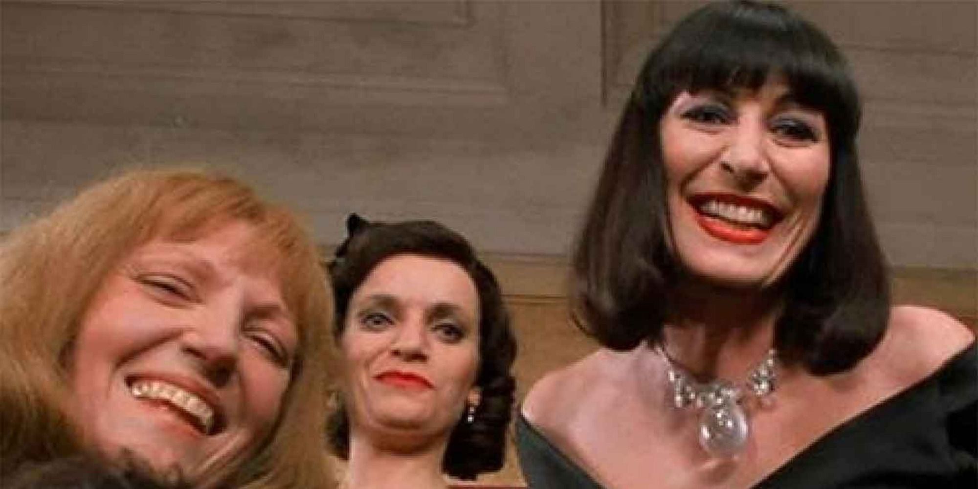 A screenshot of Anjelica Huston's Eva Ernst/The Grand High Witch and her fellow witches laughing at Bruno in The Witches (1990)