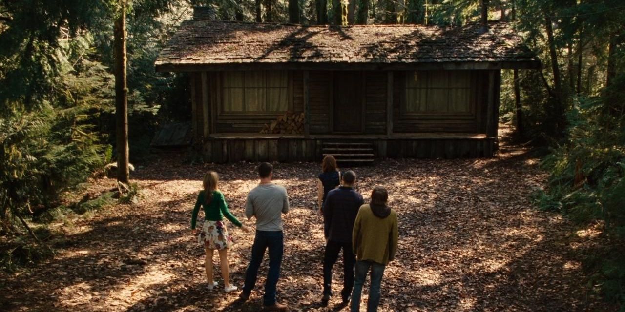 The main characters of The Cabin in the Woods standing outside the cabin and looking at it