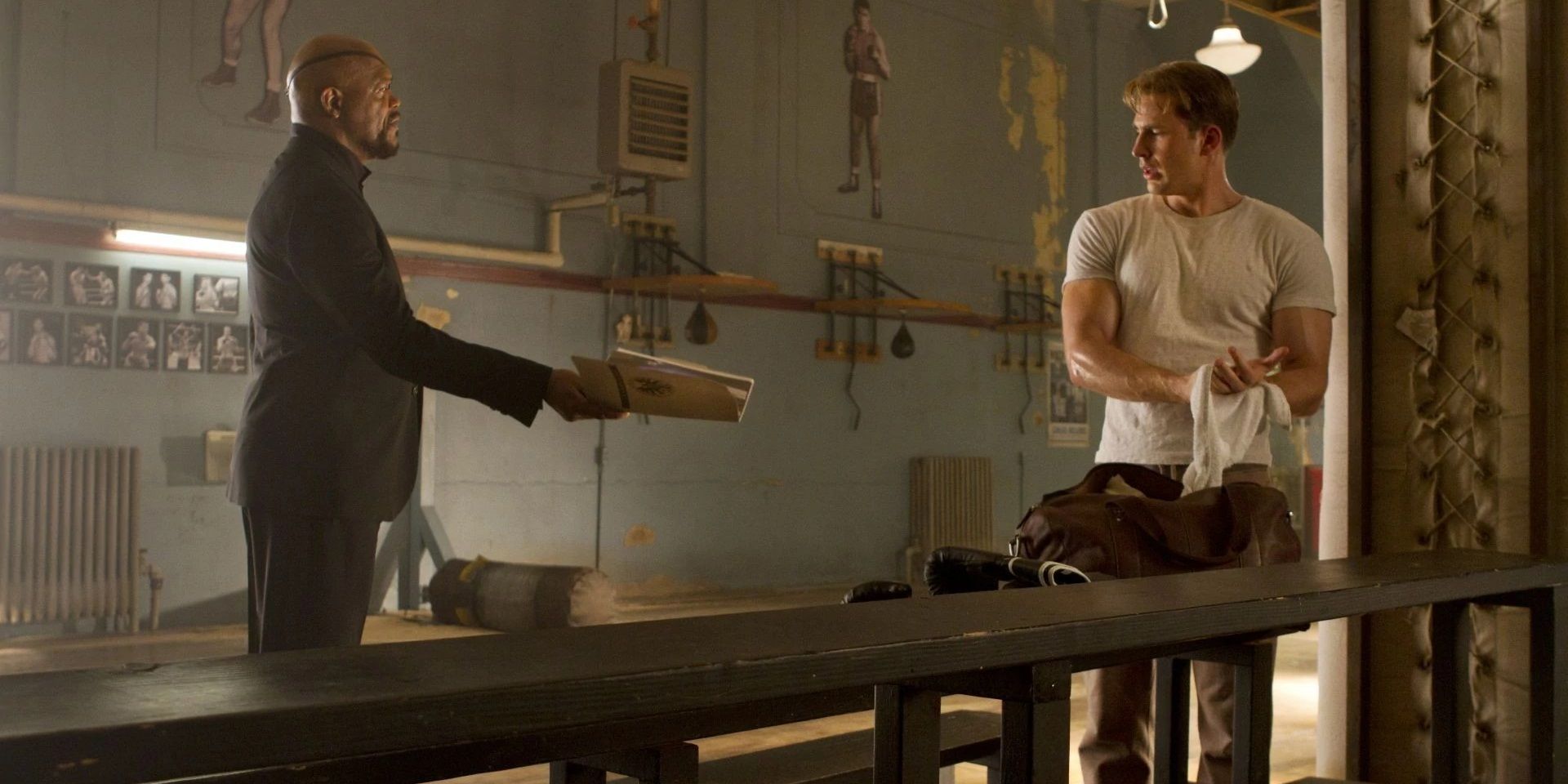 Nick Fury Handing Steve Rogers A File In Fogwell's Gym From Captain America The First Avenger.