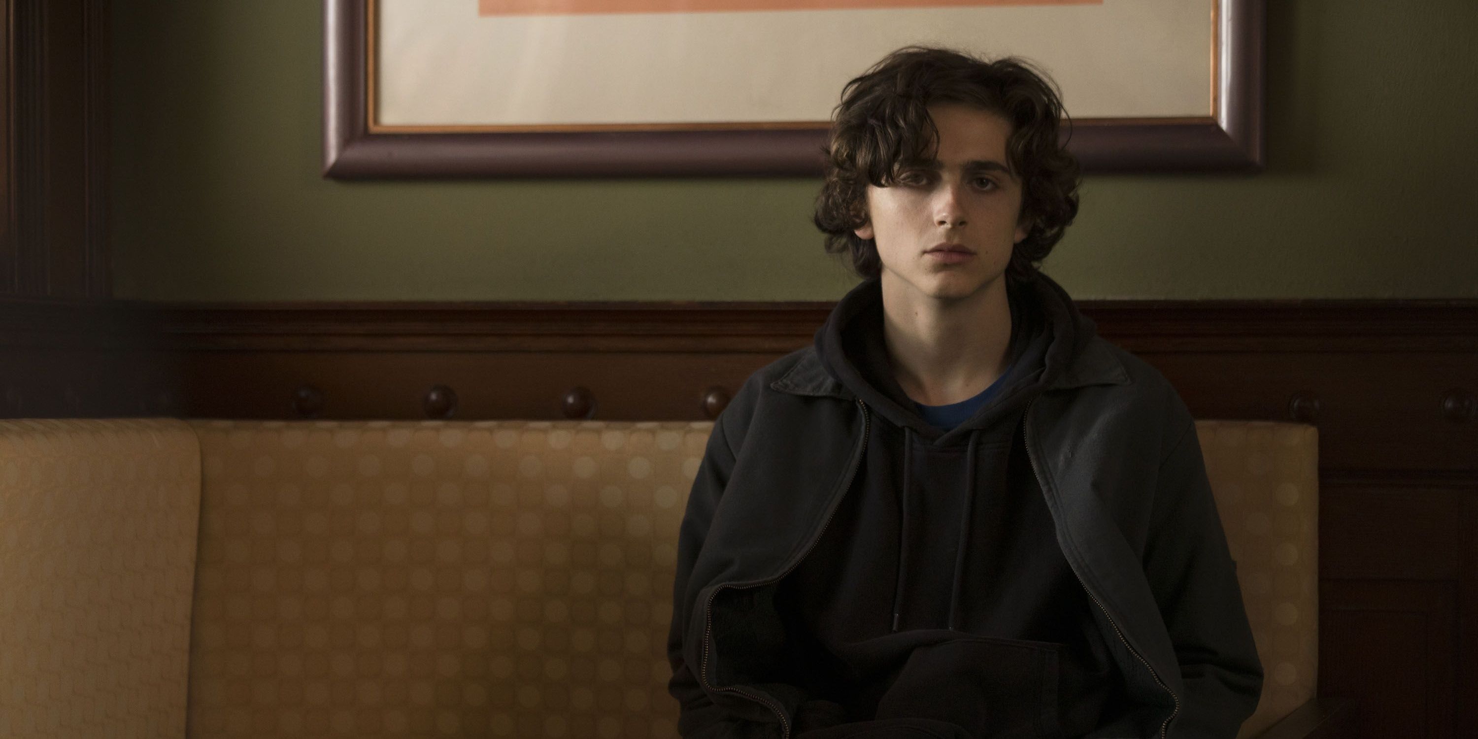Nic Sheff sitting down and looking serious in Beautiful Boy