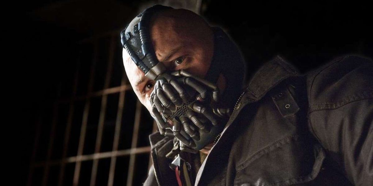 Tom Hardy as Bane looking down in The Dark Knight Rises