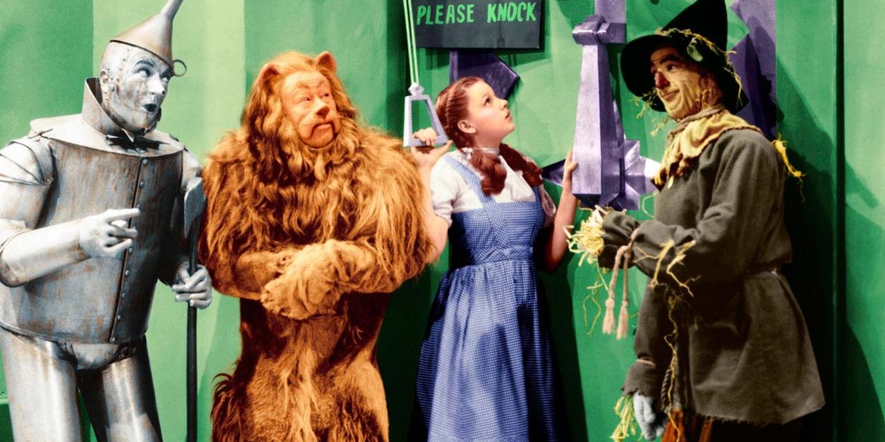 The tin man, lion, dorothy and scarecrow in Wizard of Oz 