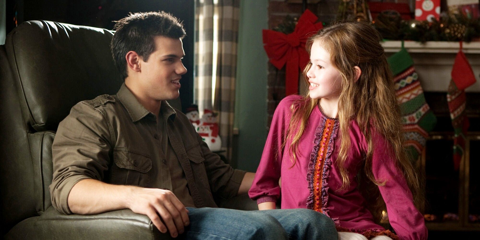 Jacob (Taylor Lautner) with Renesmee (Mackenzie Foy) in Breaking Dawn