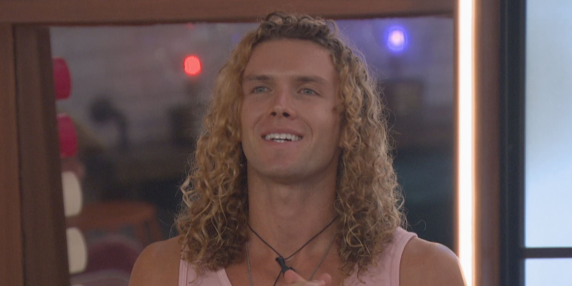 Tyler Crispen from Big Brother wearing a pink tank top.