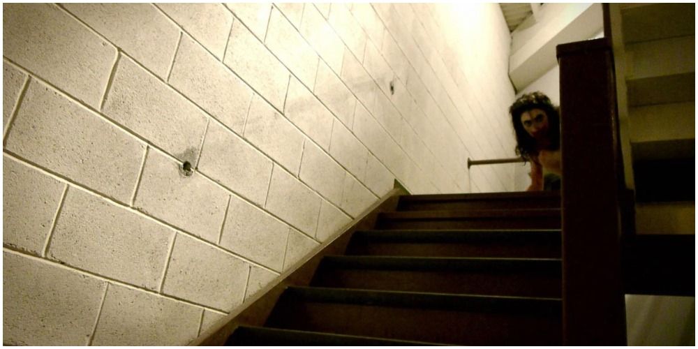Woman Looking Over A Flight Of Stairs