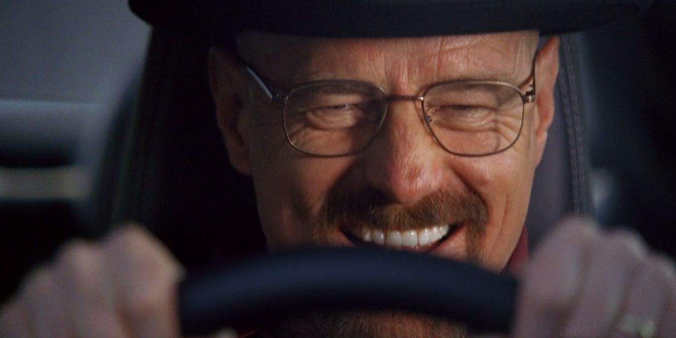 Walter driving a car, wide grin on his face