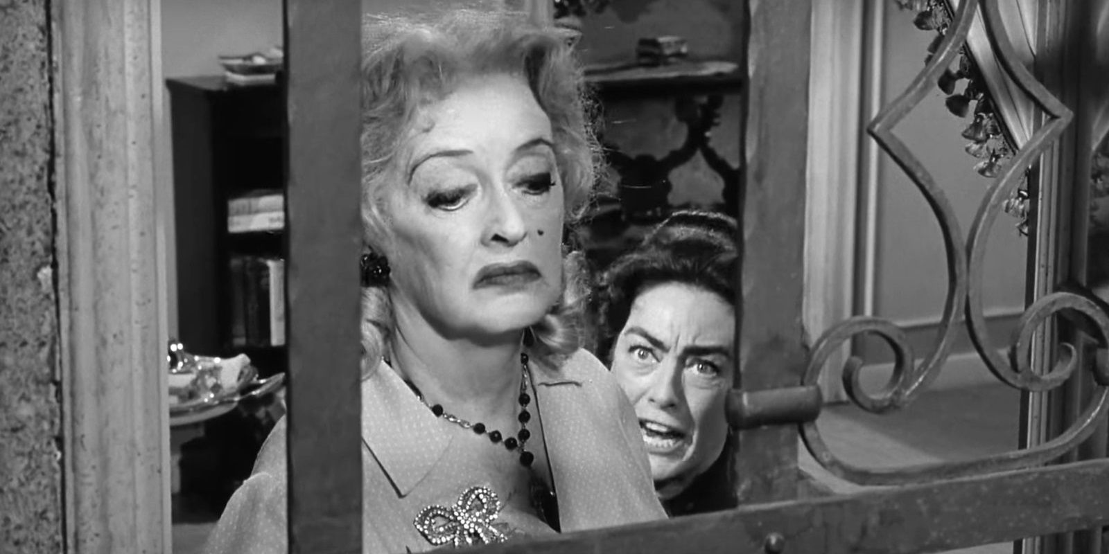 Bette Davis and Joan Crawford together at a window in What Ever Happened to Baby Jane
