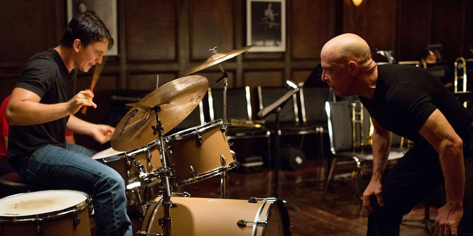 Andrew plays the drums under Fletcher's supervision in Whiplash