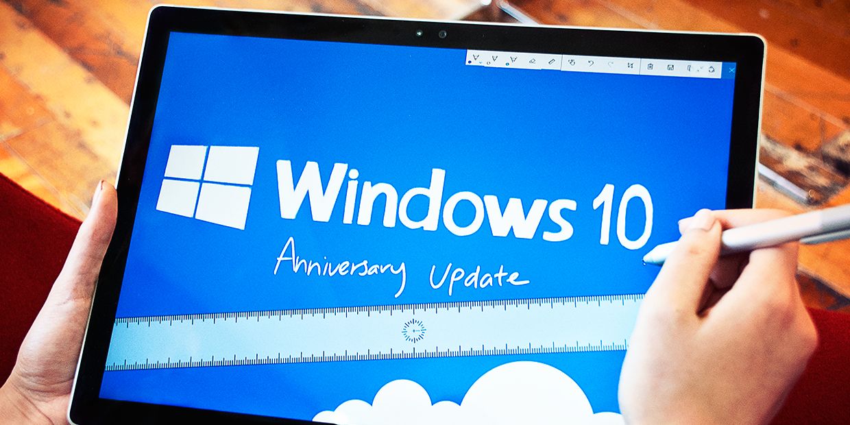 A Windows 10 Anniversary Update graphic on a tablet