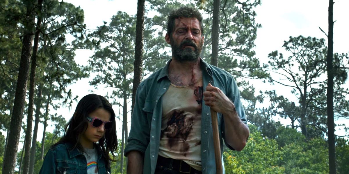 Wolverine and X-23 walk through the woods in Logan