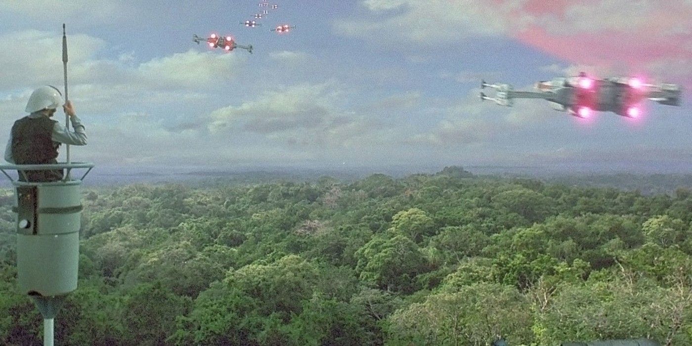 A Rebel trooper watches X-wings leave Yavin 4