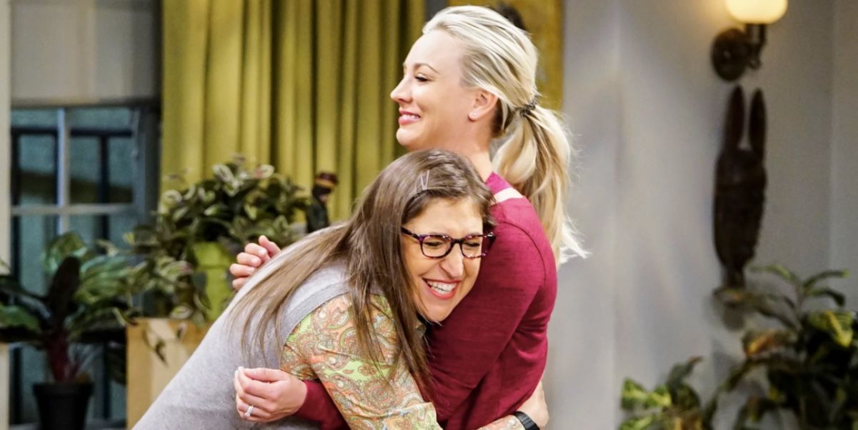 Amy and Penny hugging in a scene for TBBT