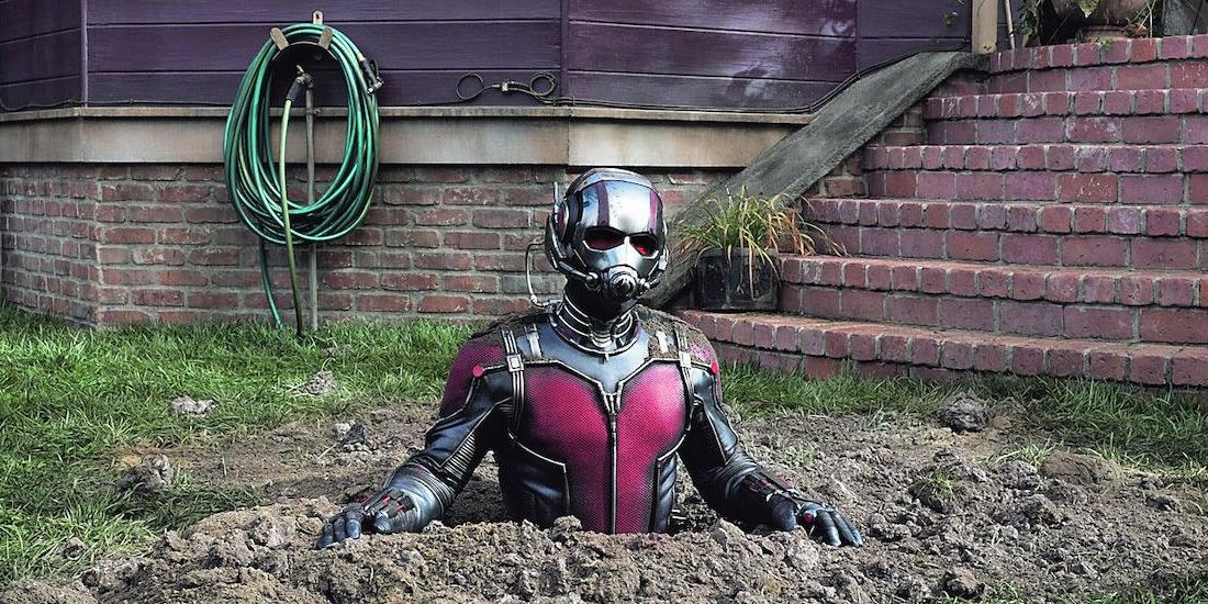 Ant-Man enlarges out of the ground in Ant-Man