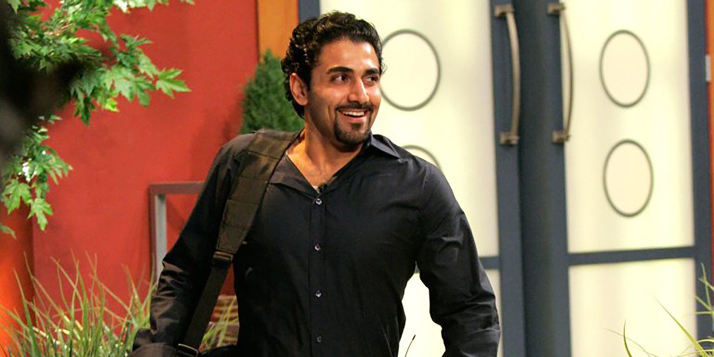 Kaysar from Big Brother, walking back into the house with his bag over his shoulder.
