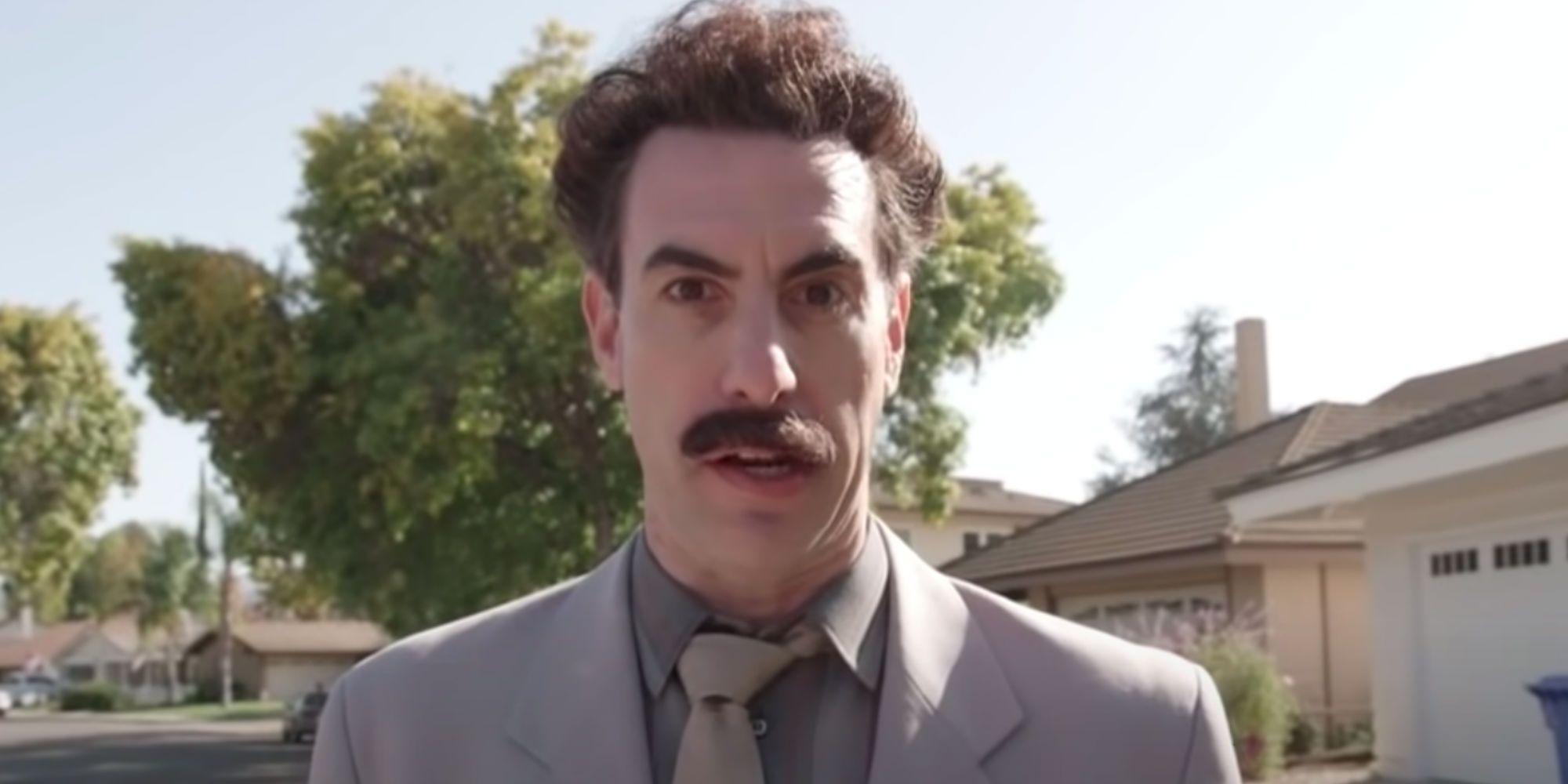 A closeup of Sacha Baron Cohen as Borat