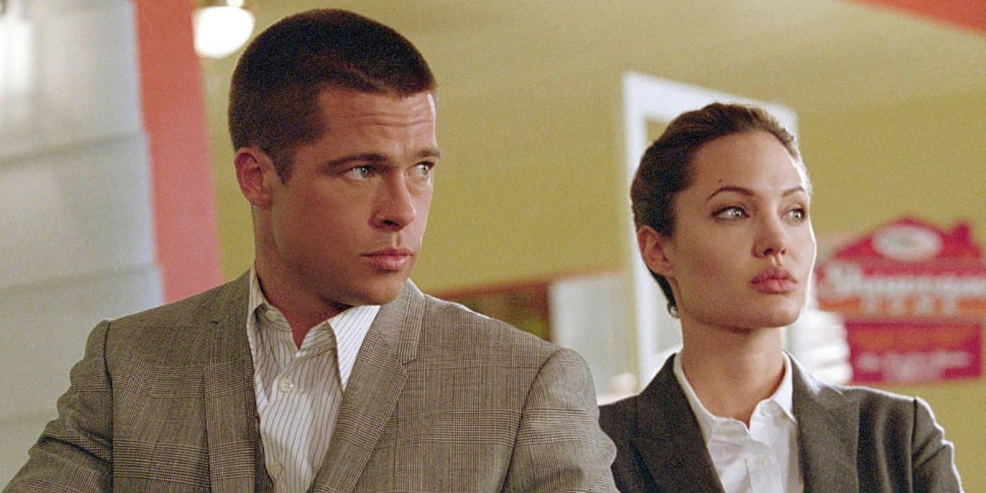 John and Jane stand together in Mr and MRs Smith