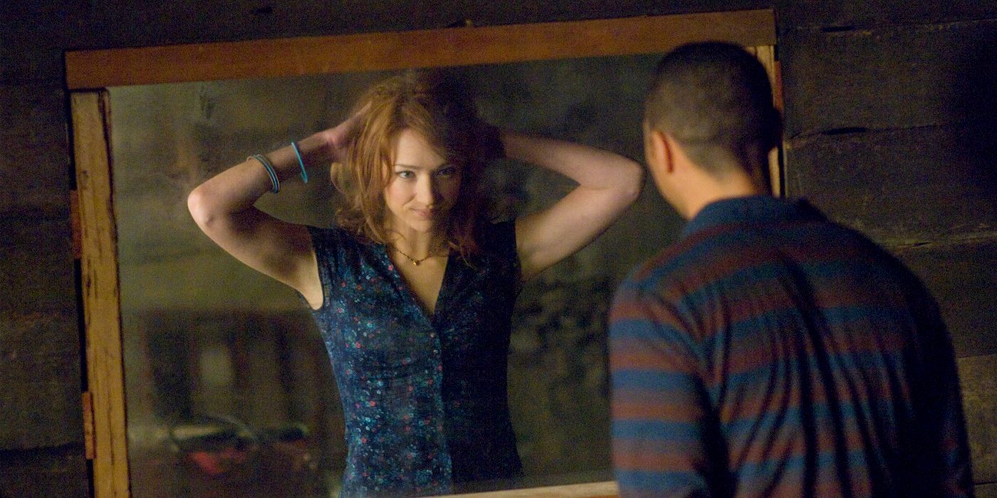 Dana looking in a mirror in The Cabin in the Woods