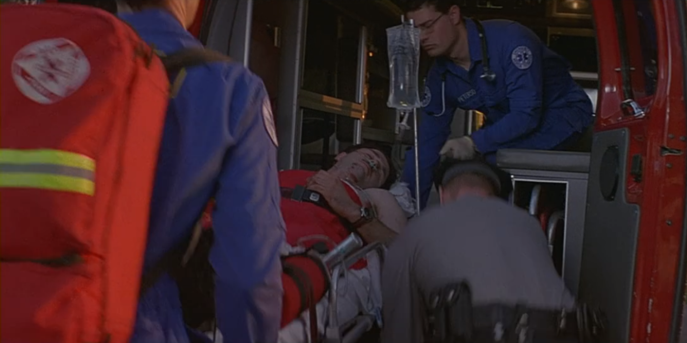 white man being loaded into ambulance by paramedics