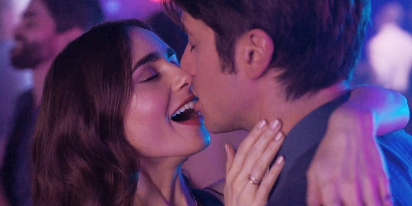 Gabriel (Lucas Bravo) kissing Emily (Lily Collins) at the club in Emily in Paris.