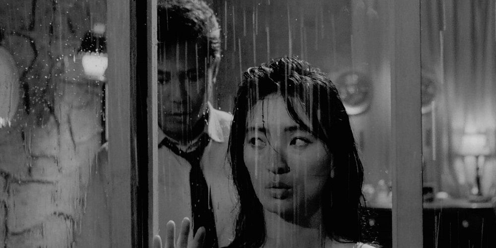 Myung-Sook looks out at the rain in The Housemaid