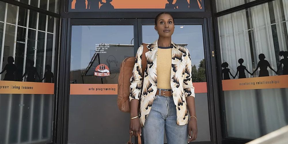 insecure issa wearing a yellow Out From Under tee with a graphic-print Dries Van Noten blazer in season 3