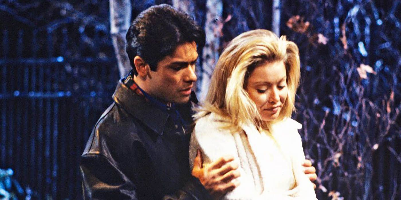 Mark Consuelos hugging Kelly Ripa in a scene from All My Children