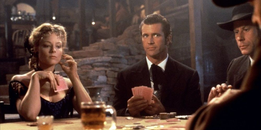 Jodie Foster and Mel Gibson playing poker in a still from Maverick.
