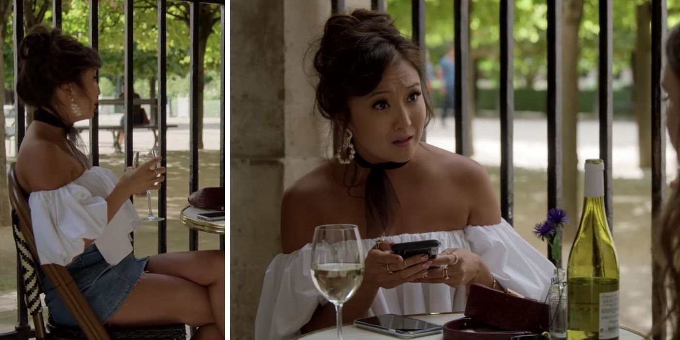 mindy sat at a table on her phone in emily in paris