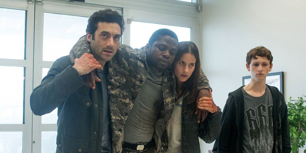 The cast of the Mist (2017) holding each other up and looking off-screen