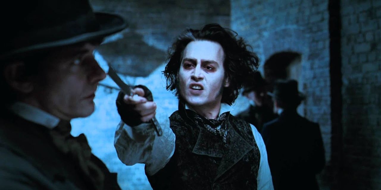 Sweeney Todd pointing his razor at someone