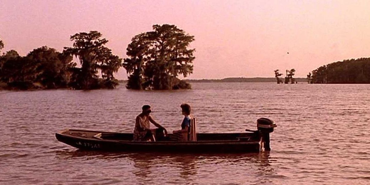 Characters on a boat at sunset in Passion Fish 1992