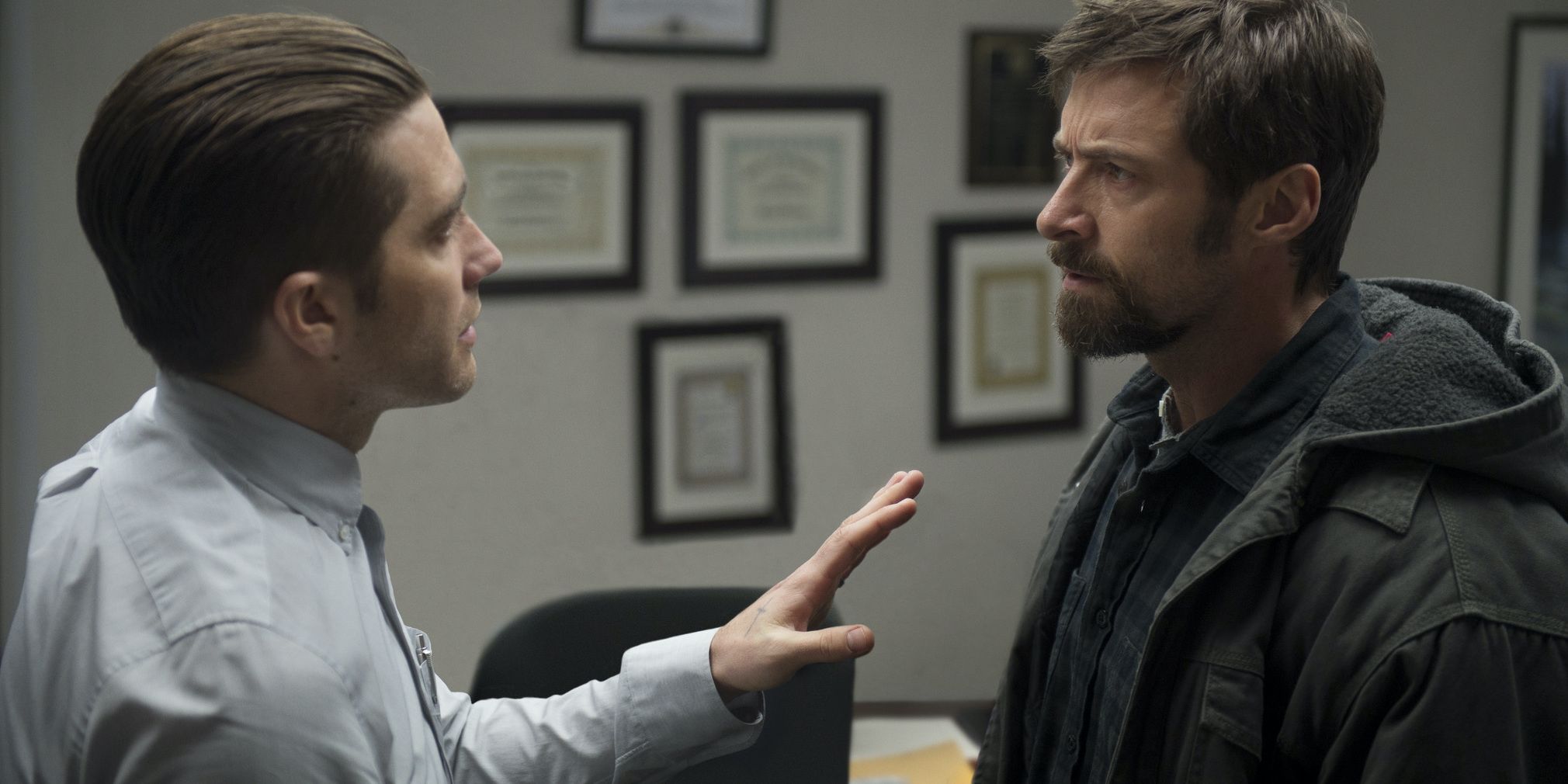 Hugh Jackman and Jake Gyllenhaal in Prisoners having a tense conversation