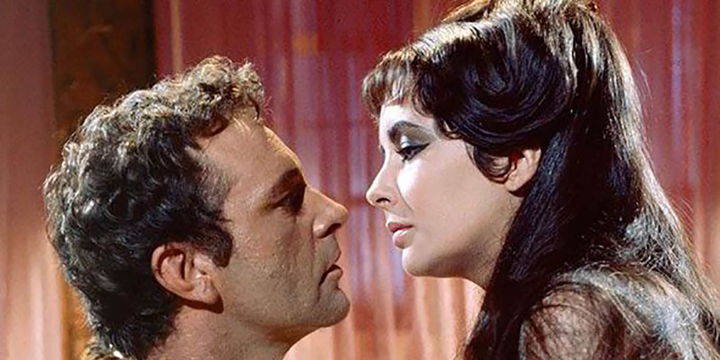 Two actors about to kiss in Cleopatra.