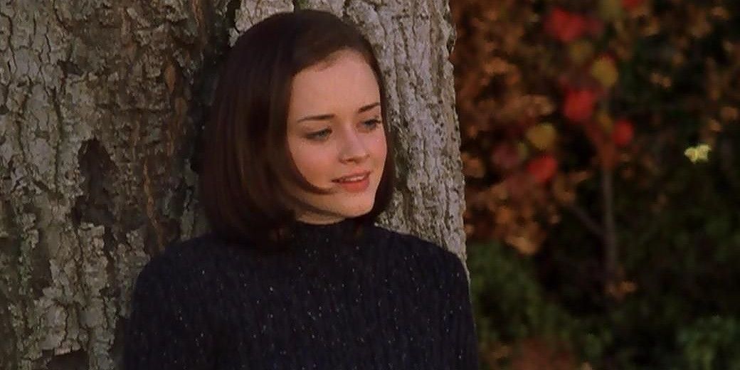 rory gilmore reading a book under a tree