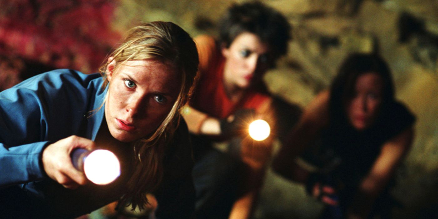 The three main characters holding flashlights in The Descent
