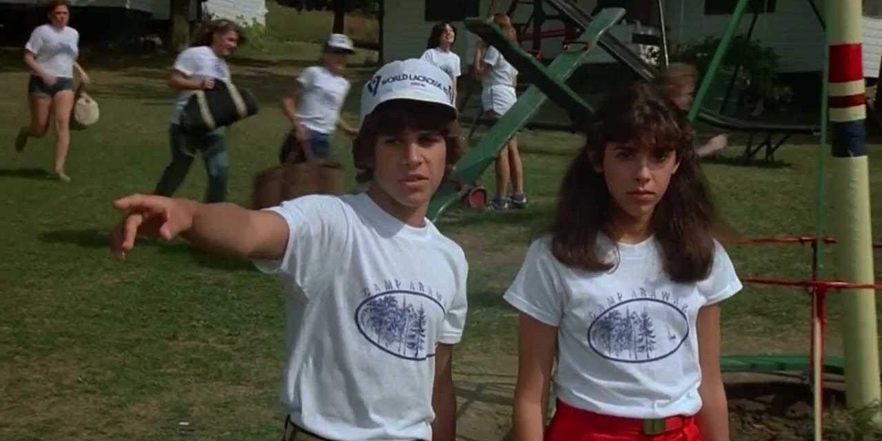 The two main characters in Sleepaway camp, one of them pointing at something in the distance