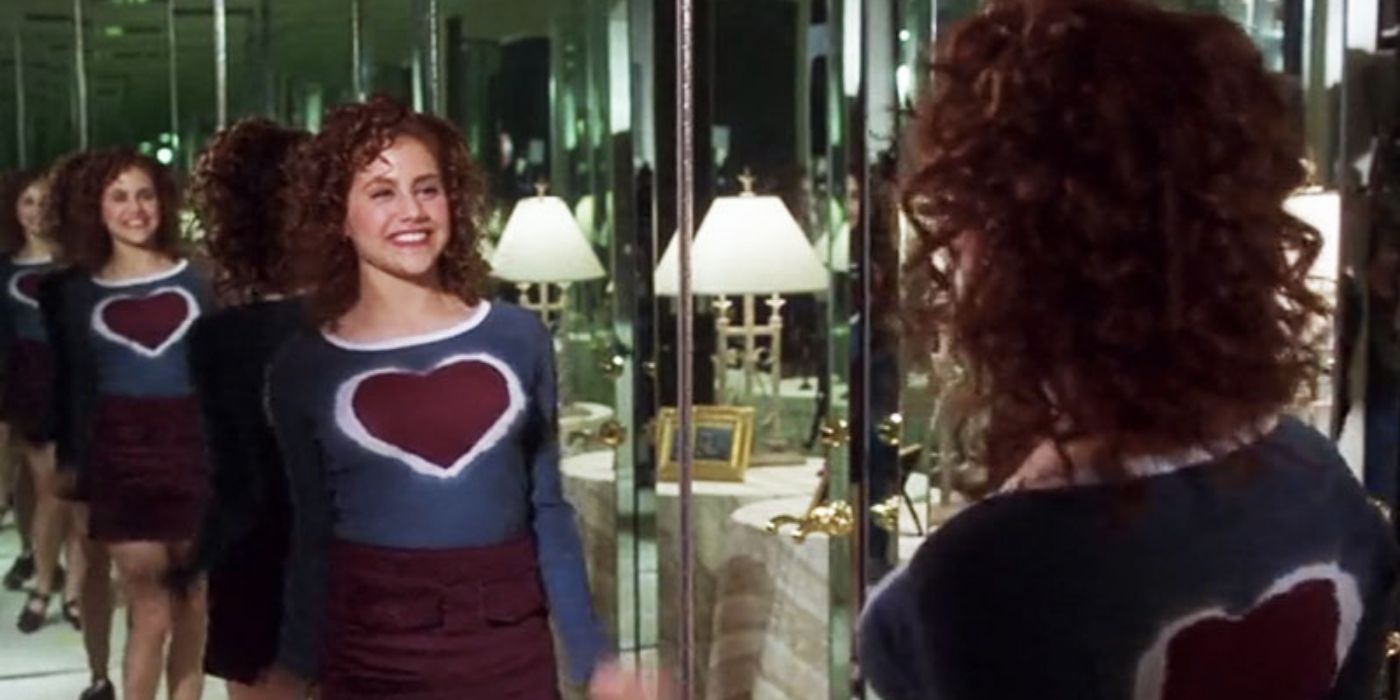 Tai looking in the mirror during her makeover in Clueless