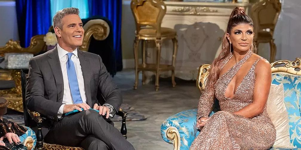 Andy Cohen and Teresa Giudice talking at a reunion of The Real Housewives Of New Jersey