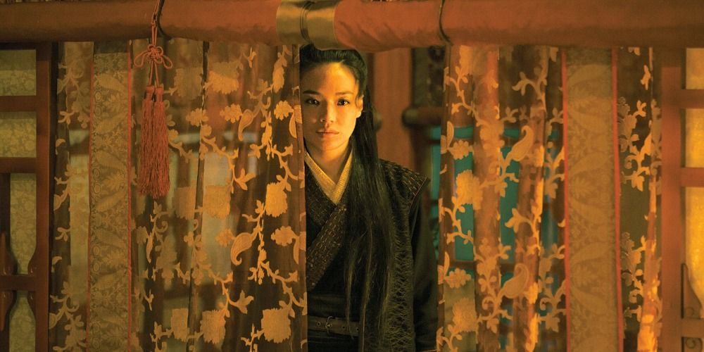 Shu Qi looking through a curtain in The Assassin 