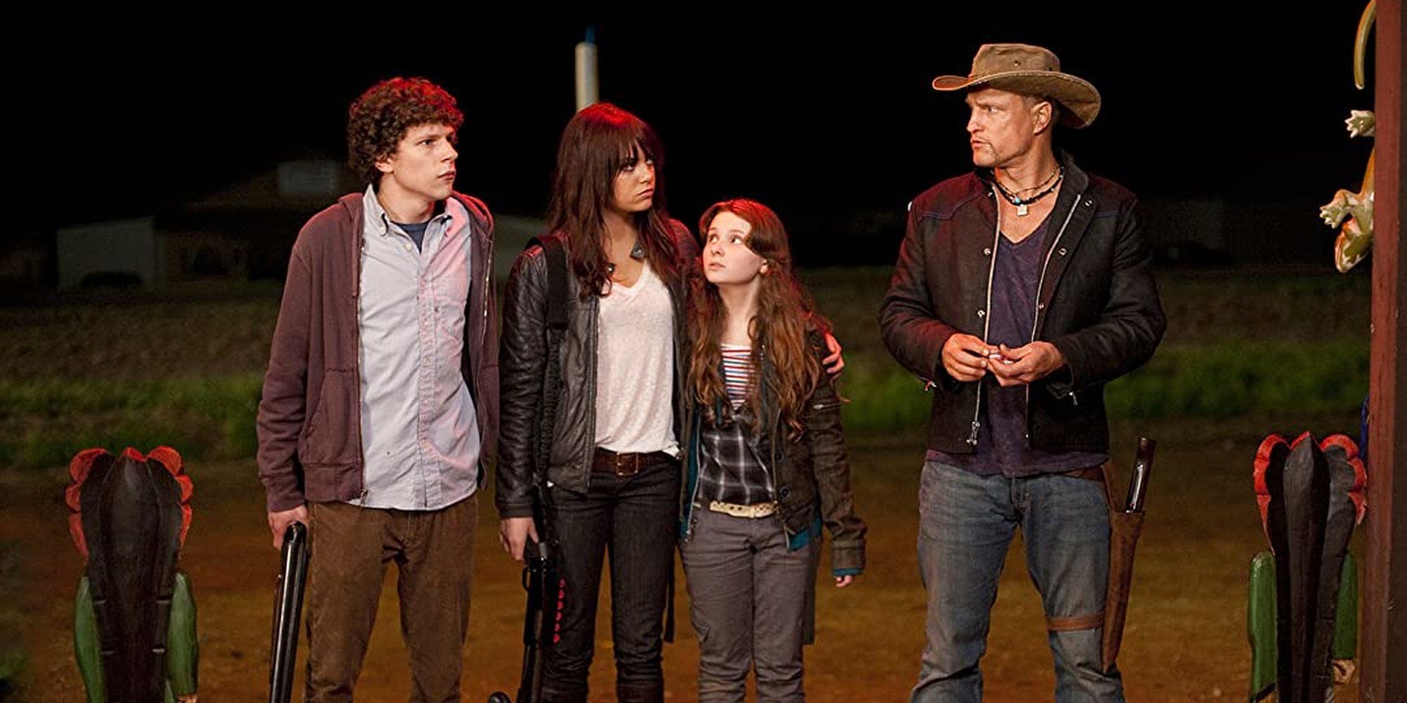 The cast stands side by side in Zombieland