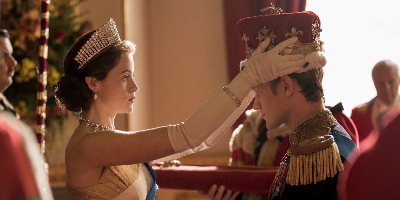 Elizabeth putting a crown on Philip in The Crown